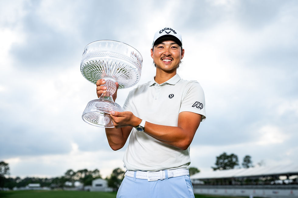 Min Woo Lee hoists the tournament trophy after capturing his first PGA Tour title at the 2025 Texas Children's Houston Open.